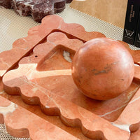 CoTheory Rosso Alicante marble tray with scalloped edges and incense holder in warm red tones