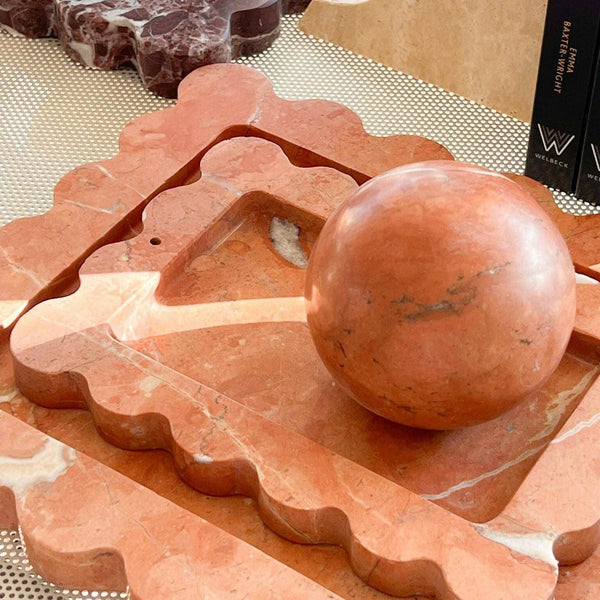 CoTheory Rosso Alicante marble tray with scalloped edges and incense holder in warm red tones