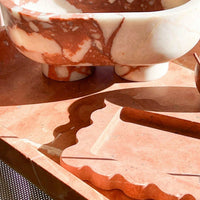 CoTheory Rosso Alicante marble tray with scalloped edges and incense holder in warm red and white tones