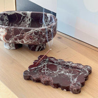 CoTheory Rosso Levanto scalloped marble tray and incense holder on wooden surface with smoke from incense stick