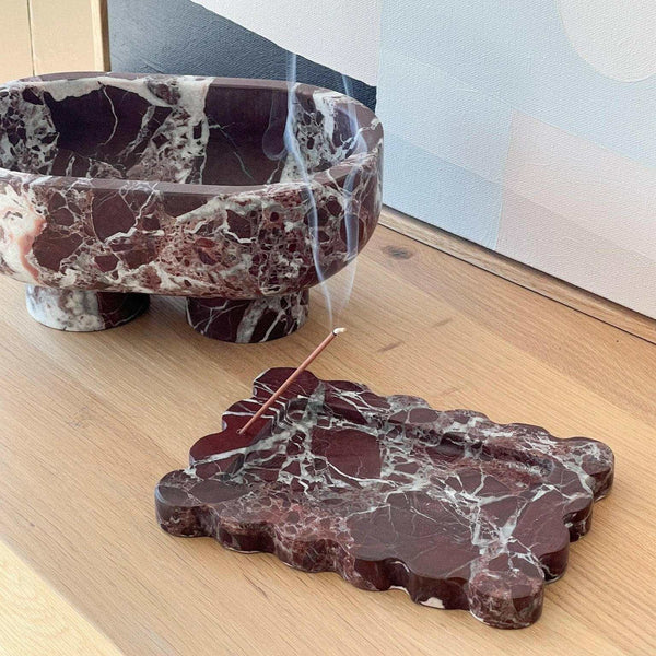 CoTheory Rosso Levanto scalloped marble tray and incense holder on wooden surface with smoke from incense stick