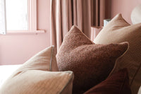 norsu Studio Forma Collection Elysian reversible blush cushion with luxe fringing and feather-down fill