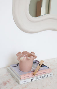 norsu Studio Flow blush ceramic two-in-one candle vessel with Alhambra scent and ruffled edge design