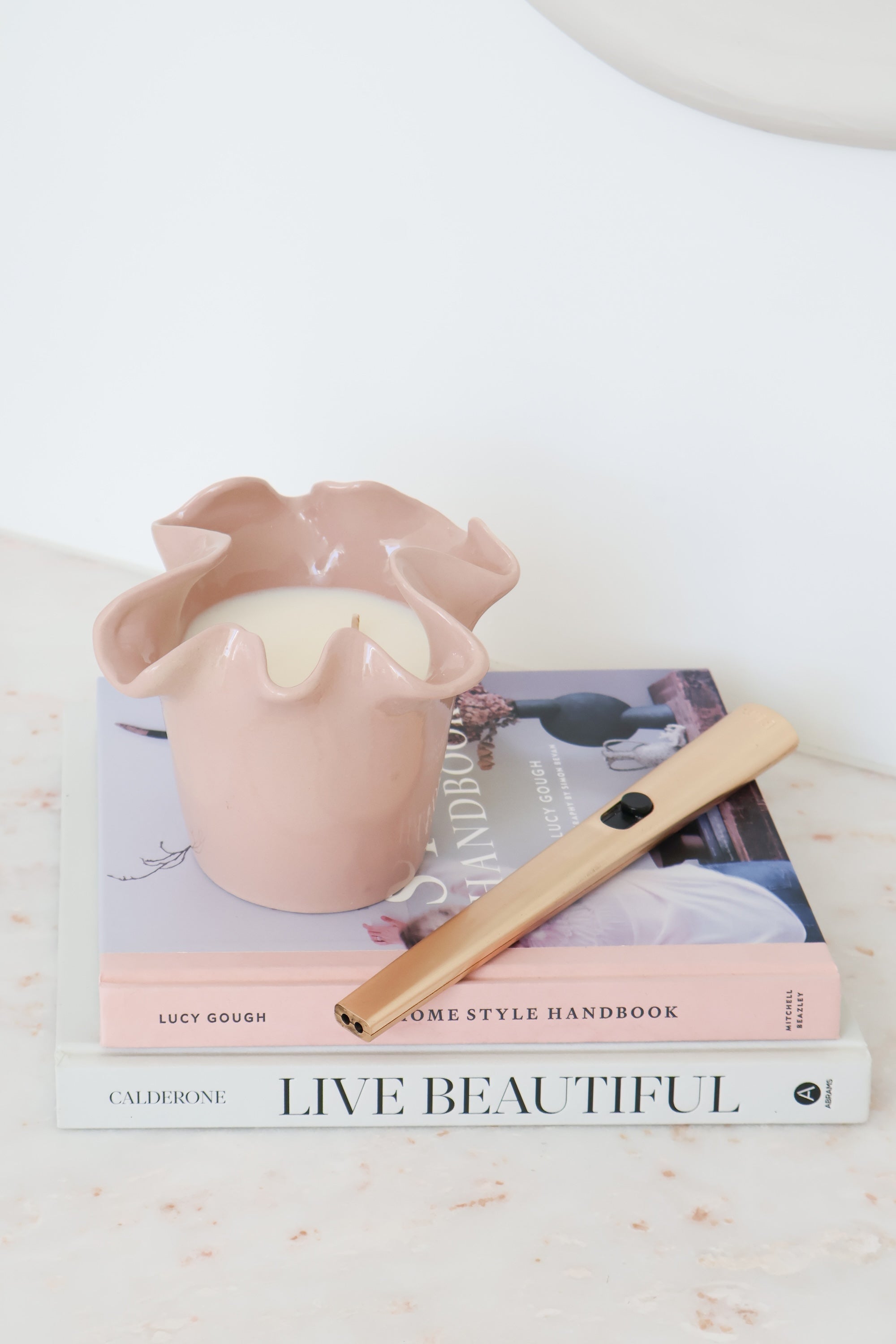 norsu Studio Flow blush ceramic two-in-one candle and vessel with ruffled edge and Alhambra scent
