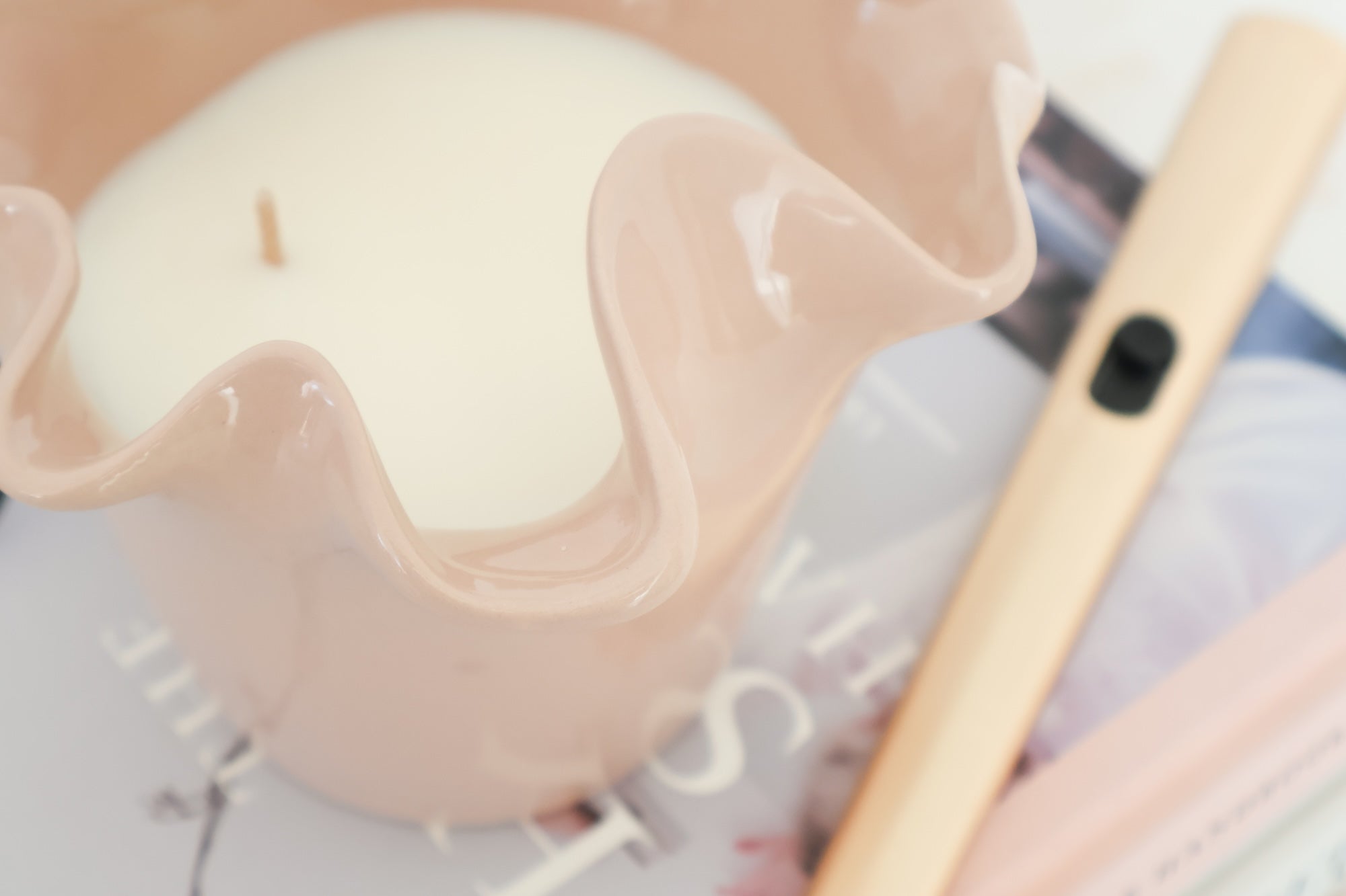 norsu Studio Flow blush sculptural ceramic candle with Alhambra scent and ruffled edge vessel