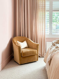 norsuHOME Swivel Chair in caramel velvet with feather cushion and playful swivel base