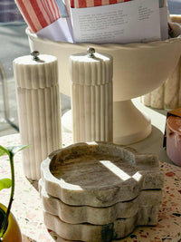 Lorne Salt + Pepper Mill made of solid marble with sleek, modern design, sold individually for luxurious kitchen use.