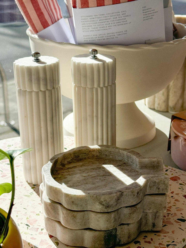 Lorne Salt + Pepper Mill made of solid marble with sleek, modern design, sold individually for luxurious kitchen use.