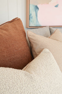 Baya Sutton Cushion in praline tone with double-sided cotton-linen chenille and fringe border, 55x55cm.