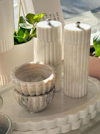 Lorne Salt + Pepper Mill solid white marble grinder with fluted design on a kitchen tray