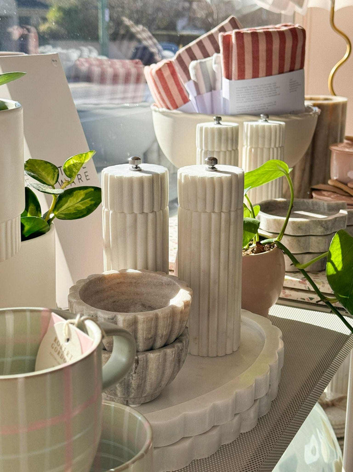 Lorne Salt + Pepper Mill, solid marble grinder with sleek, modern design on kitchen counter