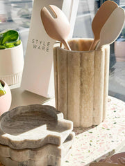 Indi Marble Spoon Rest with scalloped edges in natural marble on kitchen countertop