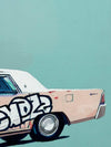 Greg Mount fine art print of a vintage car with graffiti against a pastel blue background