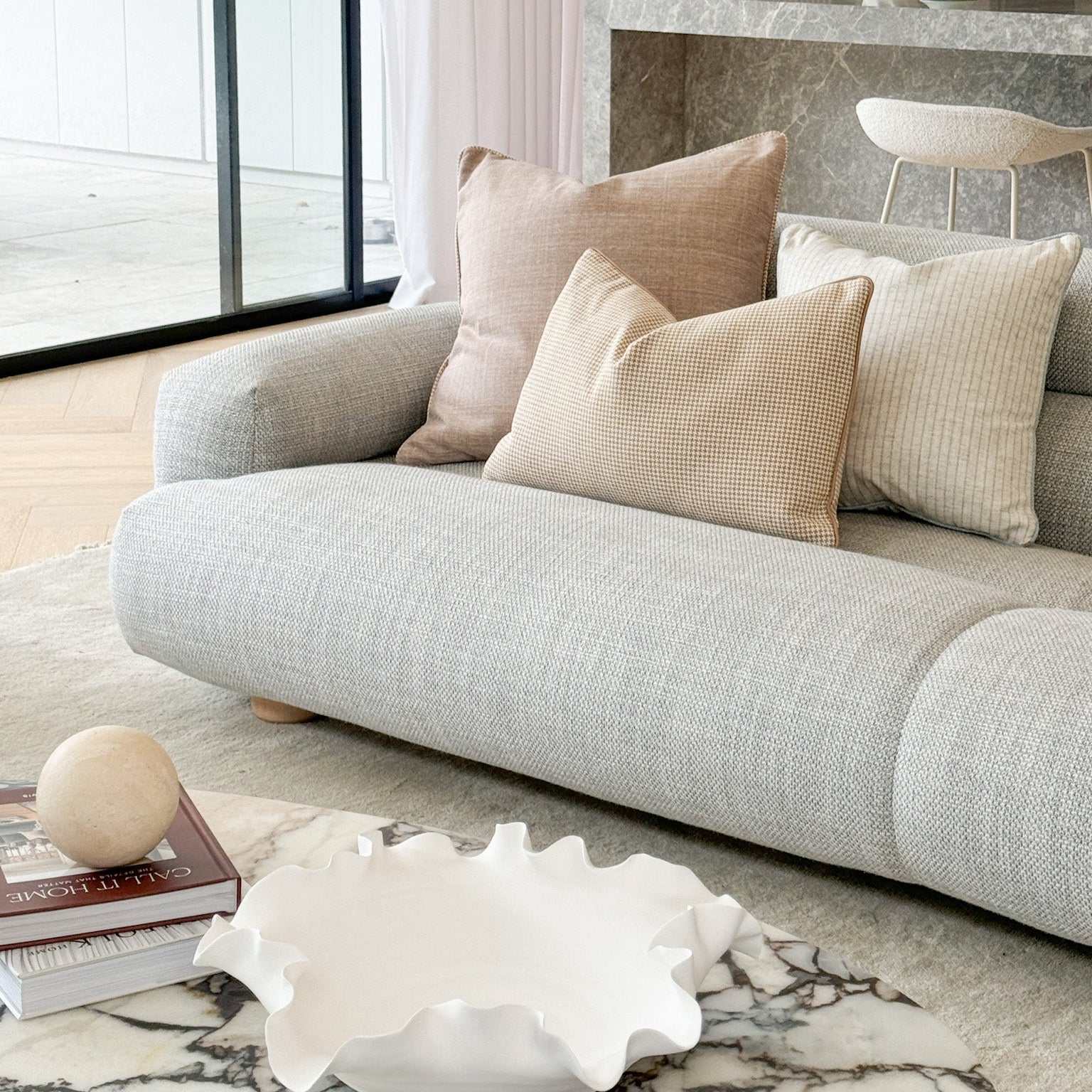 Elegant sofa with professionally styled cushion combinations to enhance living space