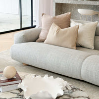 Elegant sofa with professionally styled cushion combinations to enhance living space