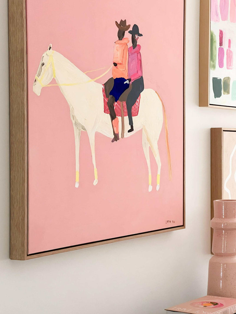 Oak framed Lottie Rae Smooth Operator fine art canvas print with abstract horse and riders on pink background