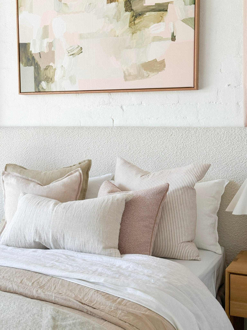 Ivory norsu Cabin Bedhead king size with textured fabric and self-piped trim above a bed with neutral pillows and bedding.