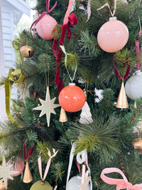 norsu STUDIO Glass Christmas baubles with velvet ribbon on tree in tomato and coral shades