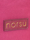 Close-up of woven fabric texture with gold norsu branding on norsu Studio Christmas Ornament storage box