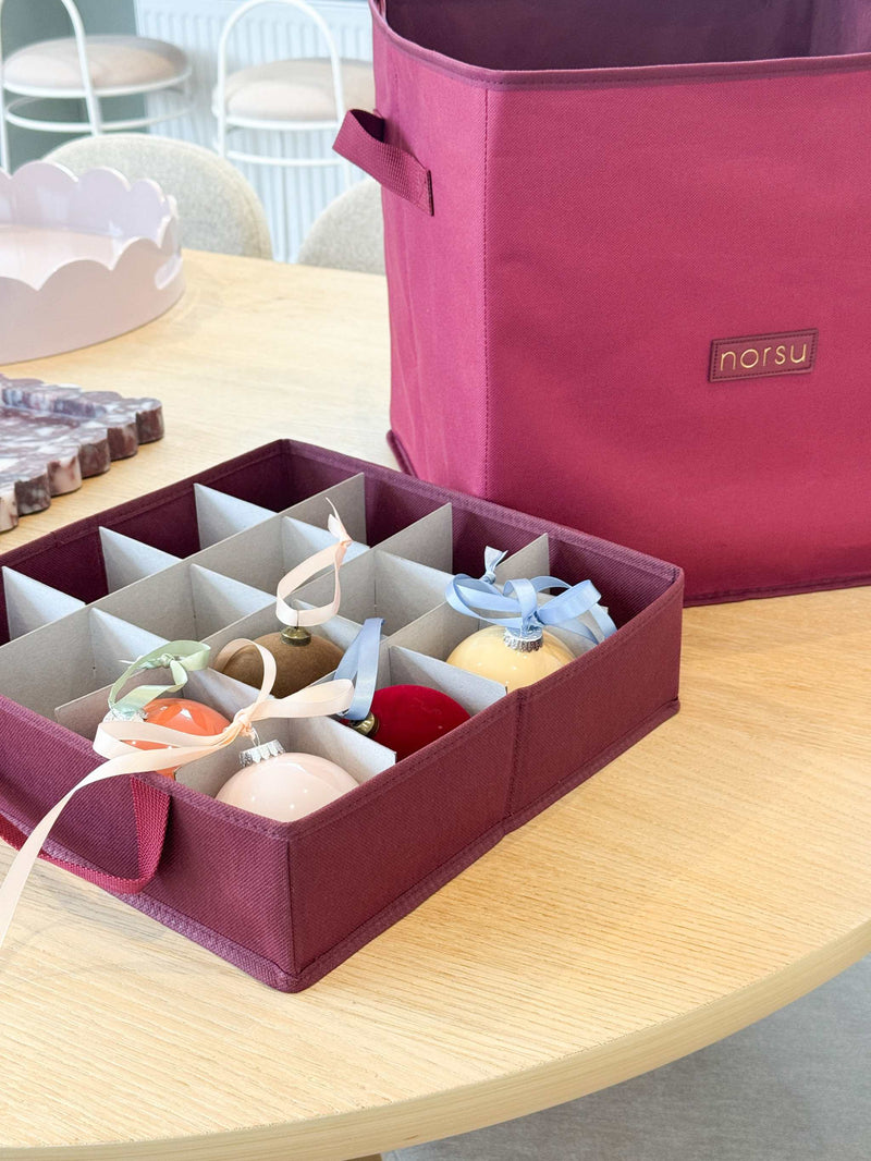 norsu Studio Christmas Ornament storage box with four pull-out trays, woven fabric, and gold zip detailing for holding 64 decorations