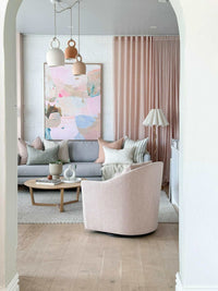 norsu Studio Swivel Chair in blush boucle fabric in a modern living room setting