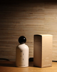 Grace and James Antibes Everything Mist styled on a timber surface