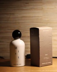 Grace and James Baja Everything Mist styled on a timber surface