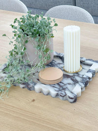 Large Palazzo scalloped marble bar tray in viola marble with decorative items on wooden table