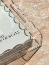 norsu Studio clear scalloped edge extra-large rectangle Perspex tray on marble surface with book inside