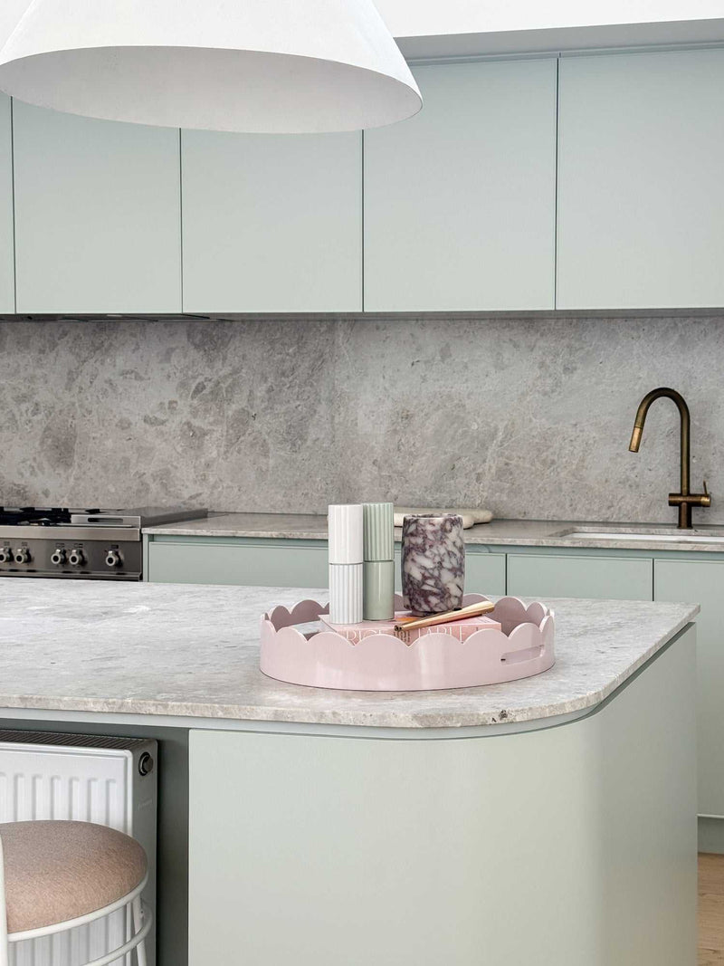 norsu STUDIO Salt & Pepper Grinders in light grey on kitchen countertop with modern kitchen background