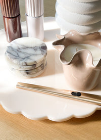 Spin Me Round blush acrylic Lazy Susan with scalloped edge and smooth rotating base available in two sizes