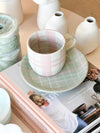 Robert Gordon Hand-Painted Mug with pink and green tartan pattern on ceramic cup and saucer set