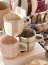 Robert Gordon Hand-Painted Mug set featuring colorful tartan and check patterns made from durable stoneware, microwave and dishwasher safe.