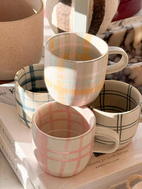 Robert Gordon hand-painted ceramic mugs with pastel tartan and gingham patterns, 350ml capacity, microwave and dishwasher safe.