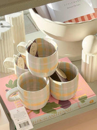 Robert Gordon Hand-Painted Mug set with pastel tartan pattern, stoneware, 350ml capacity, microwave and dishwasher safe.