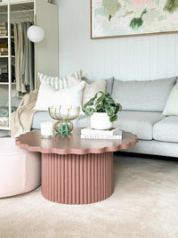 Floret Wood Coffee Table in rust with scalloped tabletop and ribbed cylindrical base