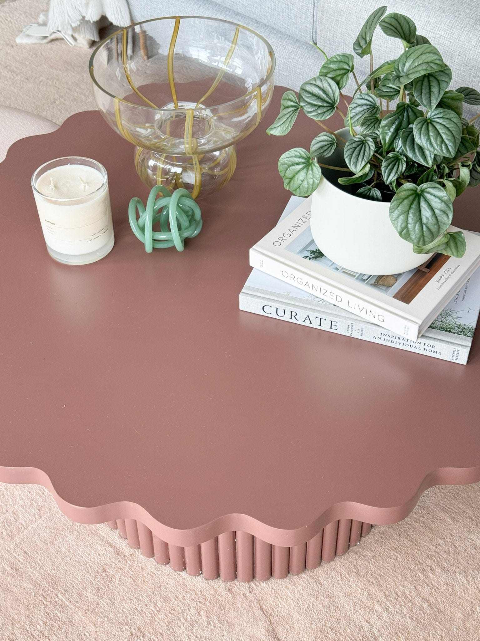 Floret Wood Coffee Table in rust with scalloped-edge tabletop and ribbed cylindrical base, modern and artistic design
