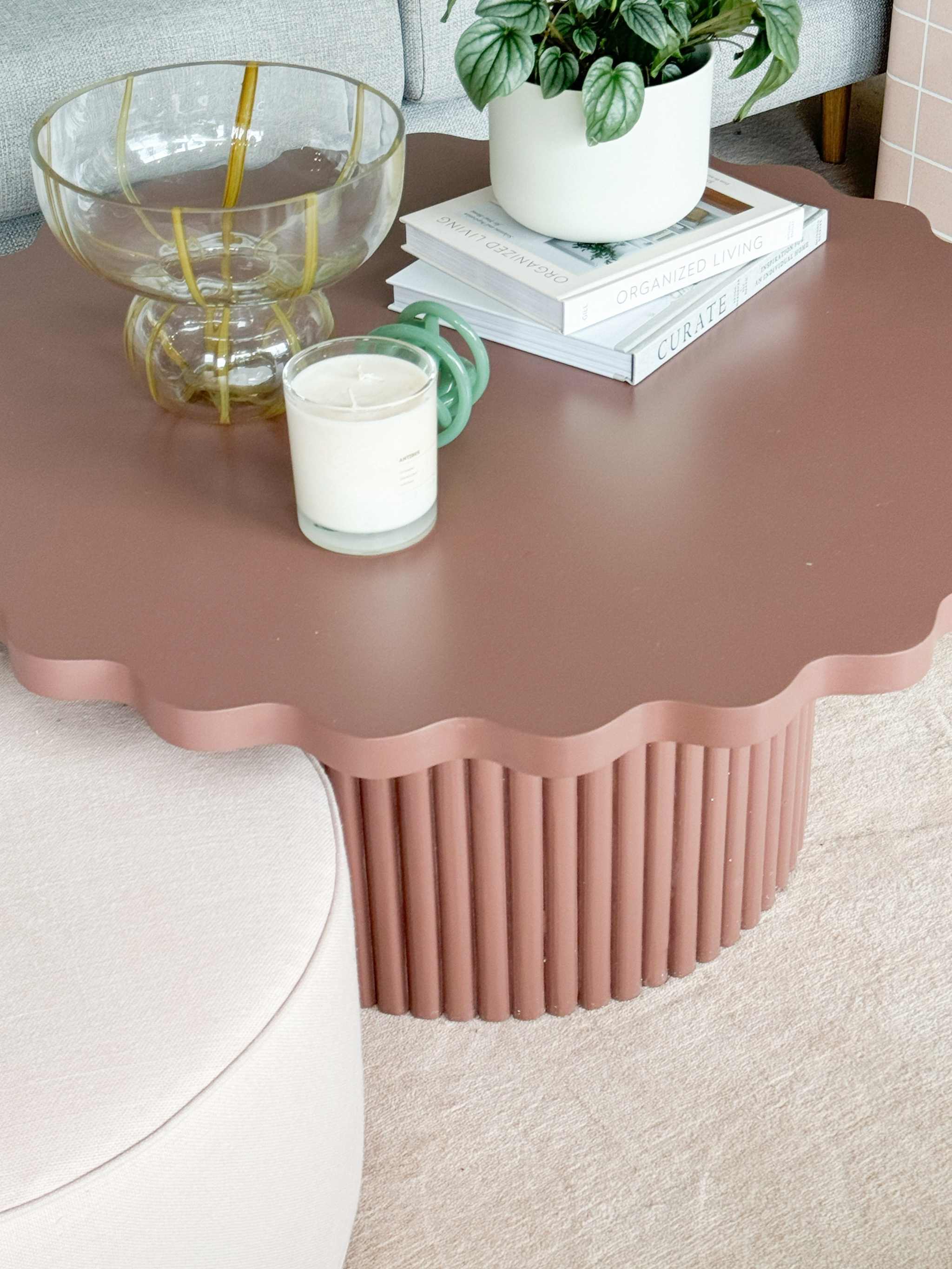 Floret Wood Coffee Table in warm rust with scalloped edge tabletop and ribbed cylindrical base.