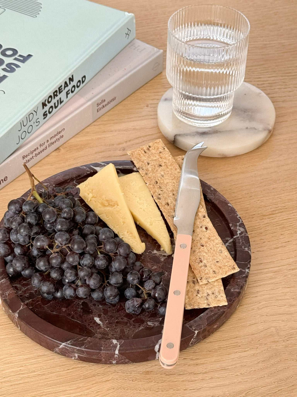 norsu STUDIO Rosso Levanto round marble tray with deep burgundy veining from Duality Collection