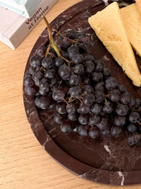 norsu STUDIO Duality Collection round Rosso Levanto marble tray with deep burgundy veining