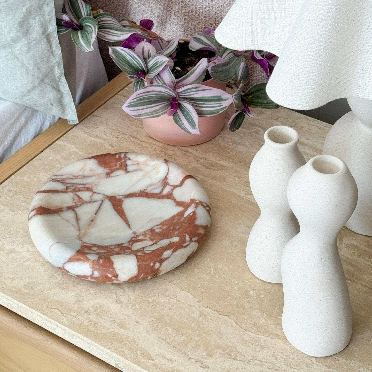 CoTheory Marble Tray Solstice small round brown Calacatta marble decorative tray with sculptural design on table