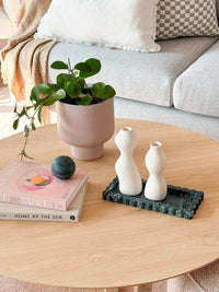 CoTheory Verdi Alpi marble scalloped bar tray with decorative white vases on wooden