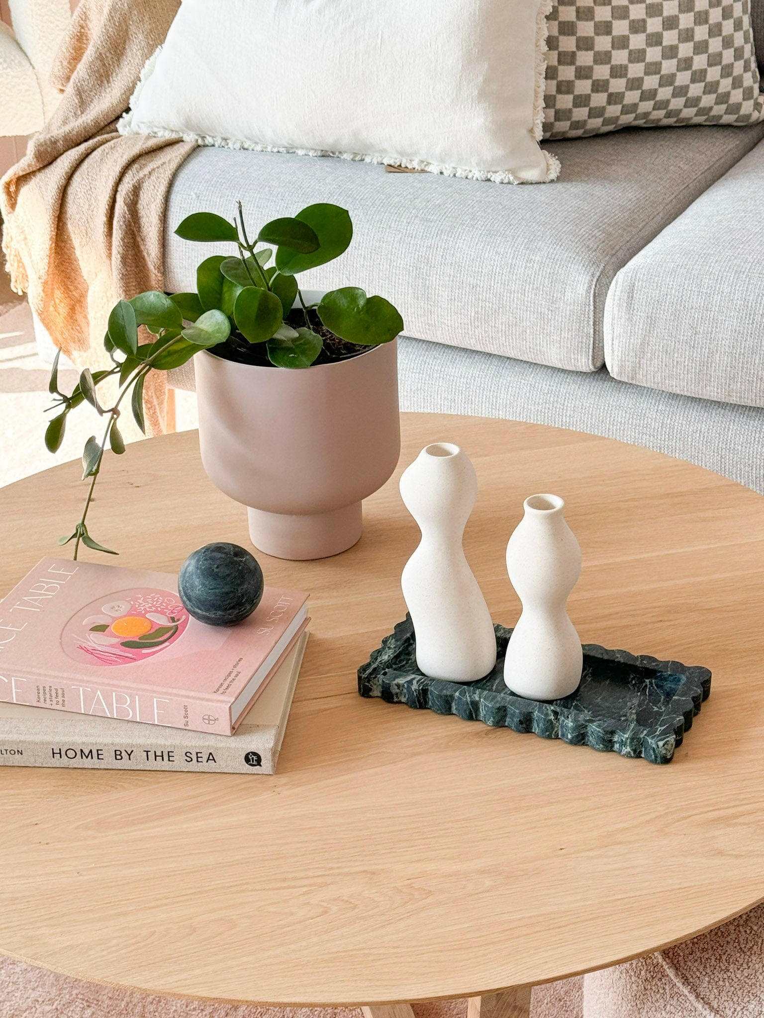 CoTheory Verdi Alpi marble scalloped bar tray with decorative white vases on wooden