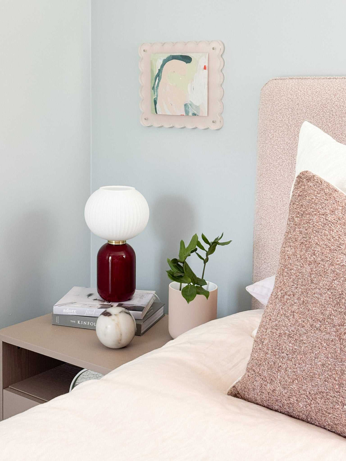 norsu STUDIO scalloped magnetic photo frame blush background on wall above bedside table