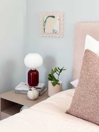 norsu STUDIO scalloped magnetic photo frame blush background on wall above bedside table