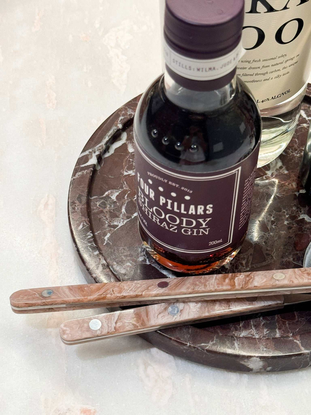 norsu STUDIO Rosso Levanto marble round tray with purple veining from Duality Collection