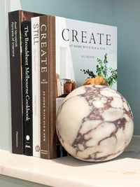 norsu Studio Viola Marble Door Stop with purple and cream veining and adjustable cotton strap