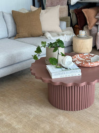 Baya Flaxmill Cushion in fenugreek on sofa with modern interior and decorative coffee table