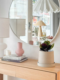 Robert Gordon Garden To Table stoneware planter with tray on wooden surface near round mirror