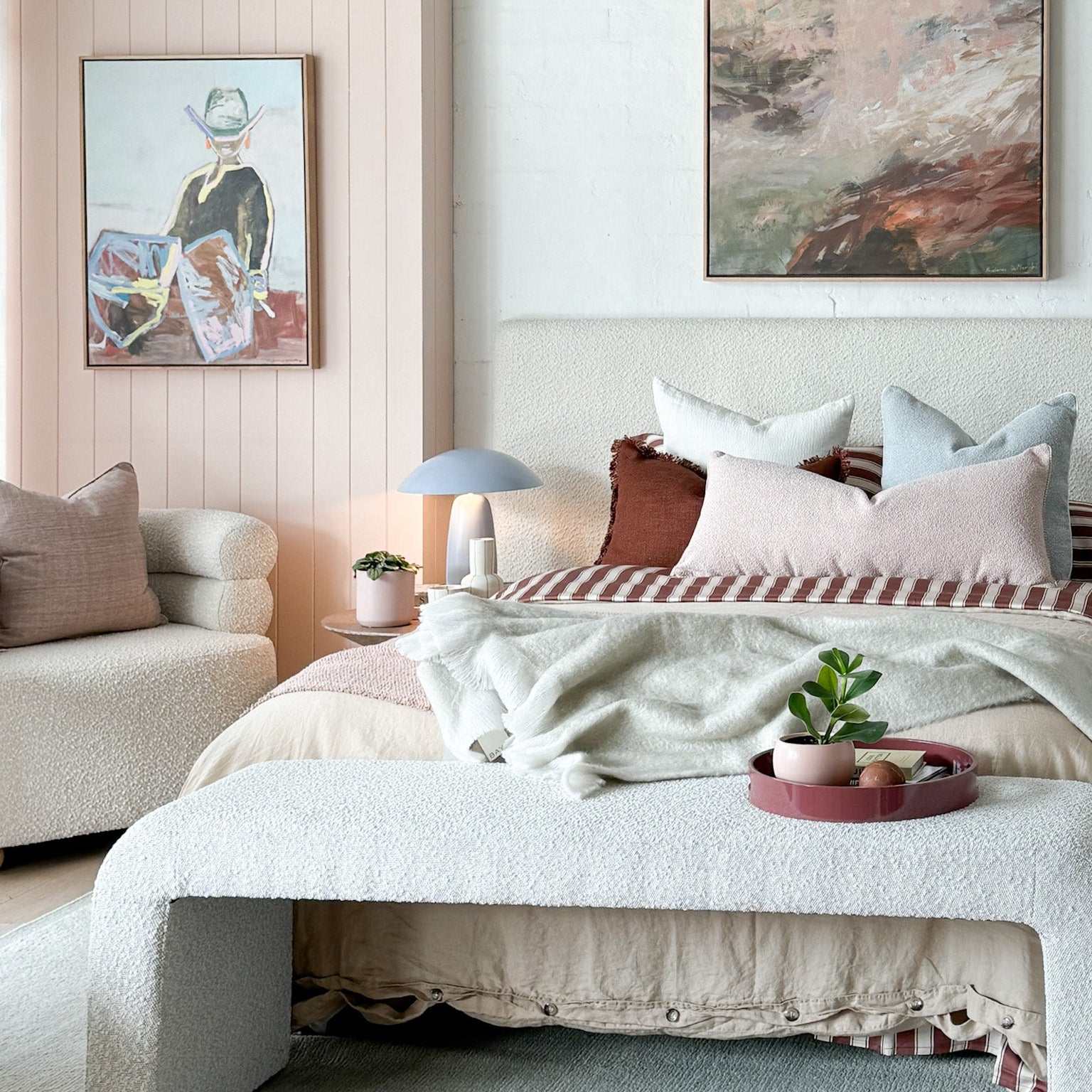 Beautifully styled bed with coordinated bedlinen and cushions for a professional bedroom look